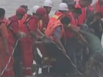 Divers search capsized ferry